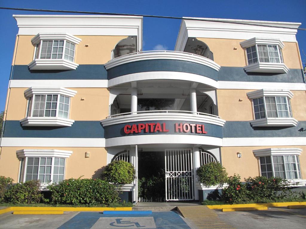 a hotel with a sign that reads capital hotel at Capital Hotel in Garapan