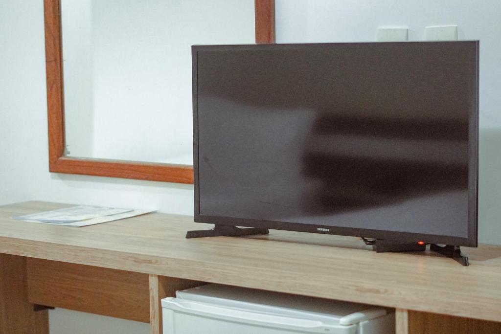 TV a/nebo společenská místnost v ubytování Sarana Praia Hotel