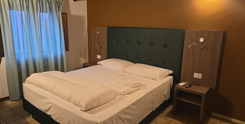 Postel nebo postele na pokoji v ubytování Albergo Al Gambero