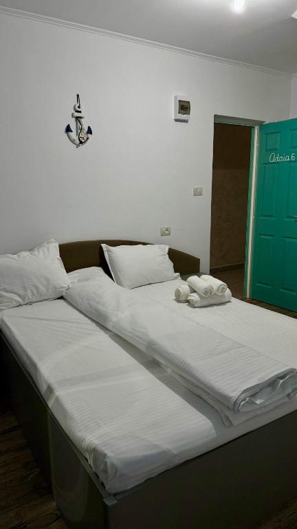 Postel nebo postele na pokoji v ubytování Casa Enisala