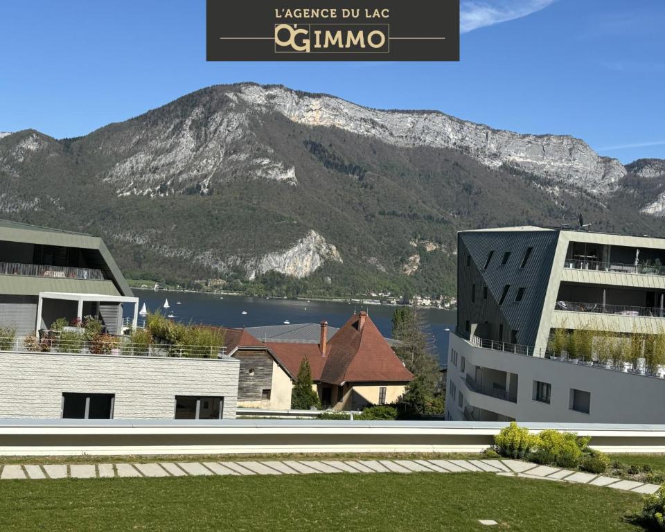 a building with a view of a mountain at View Point Lake and Mountains in Annecy