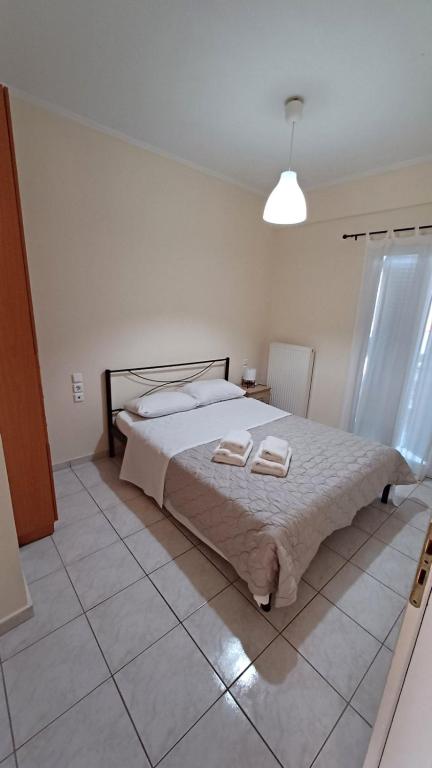 Posteľ alebo postele v izbe v ubytovaní Ostria Seaside Apartments