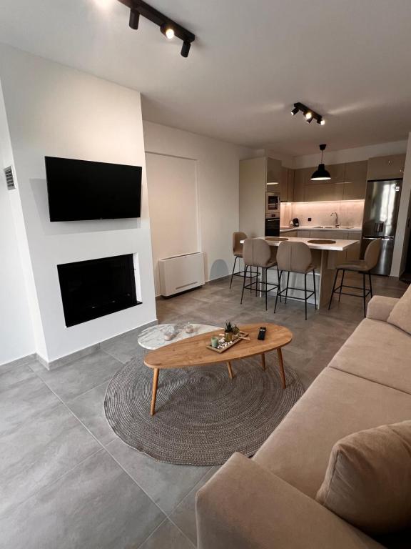 Televízia a/alebo spoločenská miestnosť v ubytovaní Phil's Apartments