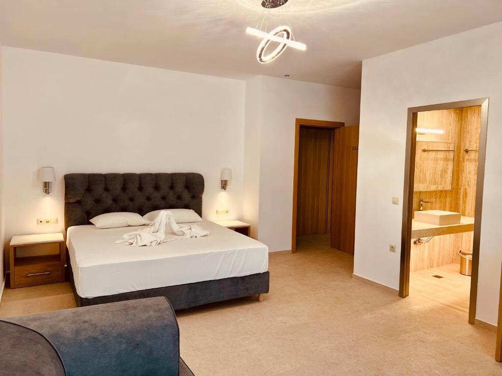Postel nebo postele na pokoji v ubytování Lili Hotel