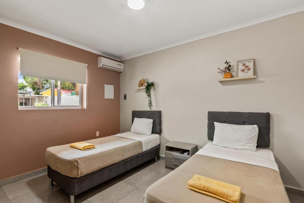 Postel nebo postele na pokoji v ubytování Curadise Living