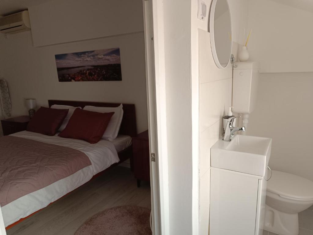 Postel nebo postele na pokoji v ubytování Zemun Central