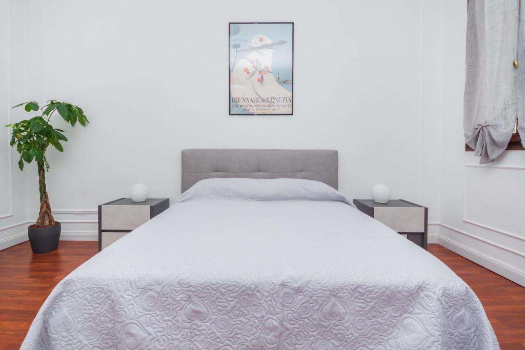 Ένα ή περισσότερα κρεβάτια σε δωμάτιο στο Opera Venice Apartment