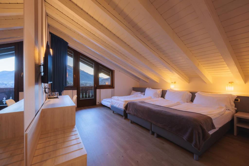 Postel nebo postele na pokoji v ubytování Hotel Binelli