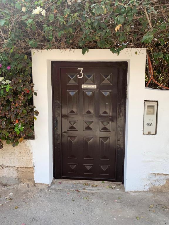 a black door in the side of a building at Dar Salam in Agadir