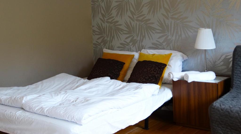 Posteľ alebo postele v izbe v ubytovaní Apartamenty Miku