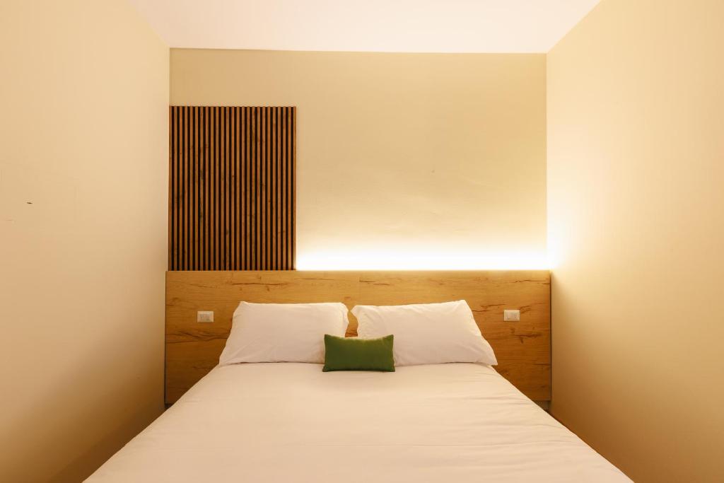 Postel nebo postele na pokoji v ubytování Botanique Hotel Vergani