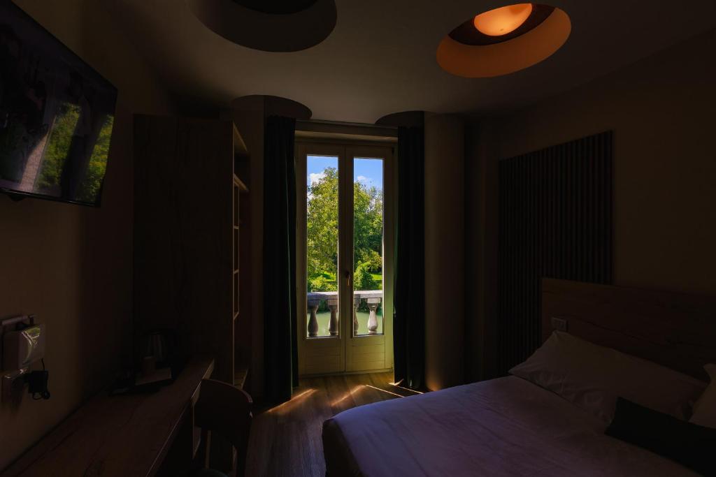Postel nebo postele na pokoji v ubytování Botanique Hotel Vergani