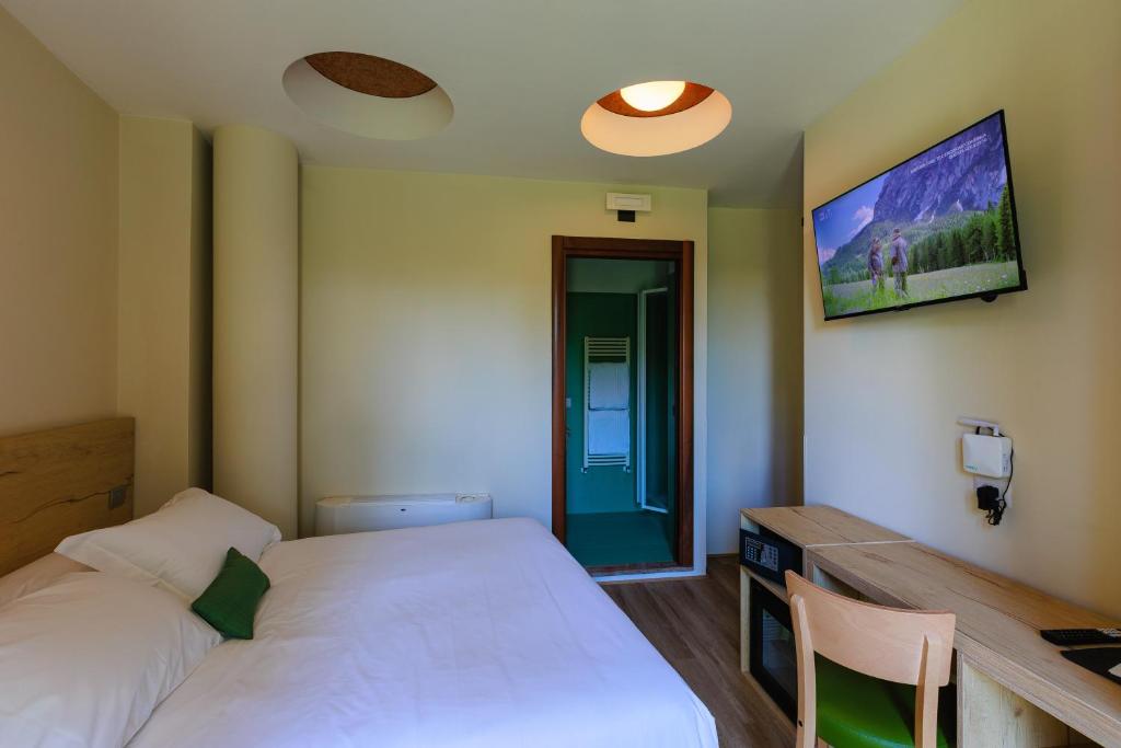 Postel nebo postele na pokoji v ubytování Botanique Hotel Vergani
