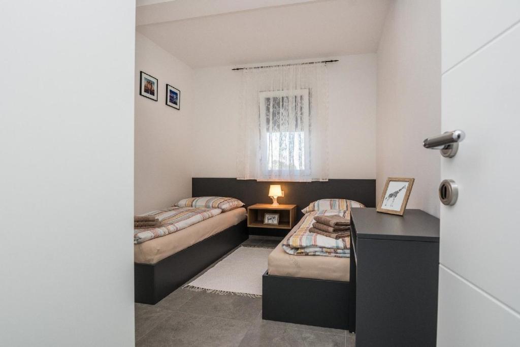 Posteľ alebo postele v izbe v ubytovaní Apartment Spanic 2