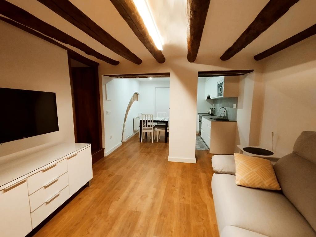 Televízia a/alebo spoločenská miestnosť v ubytovaní CASA PETRA