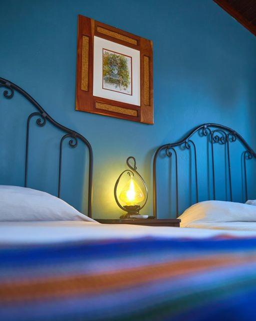 Postel nebo postele na pokoji v ubytování Hotel Plaza Yat Balam