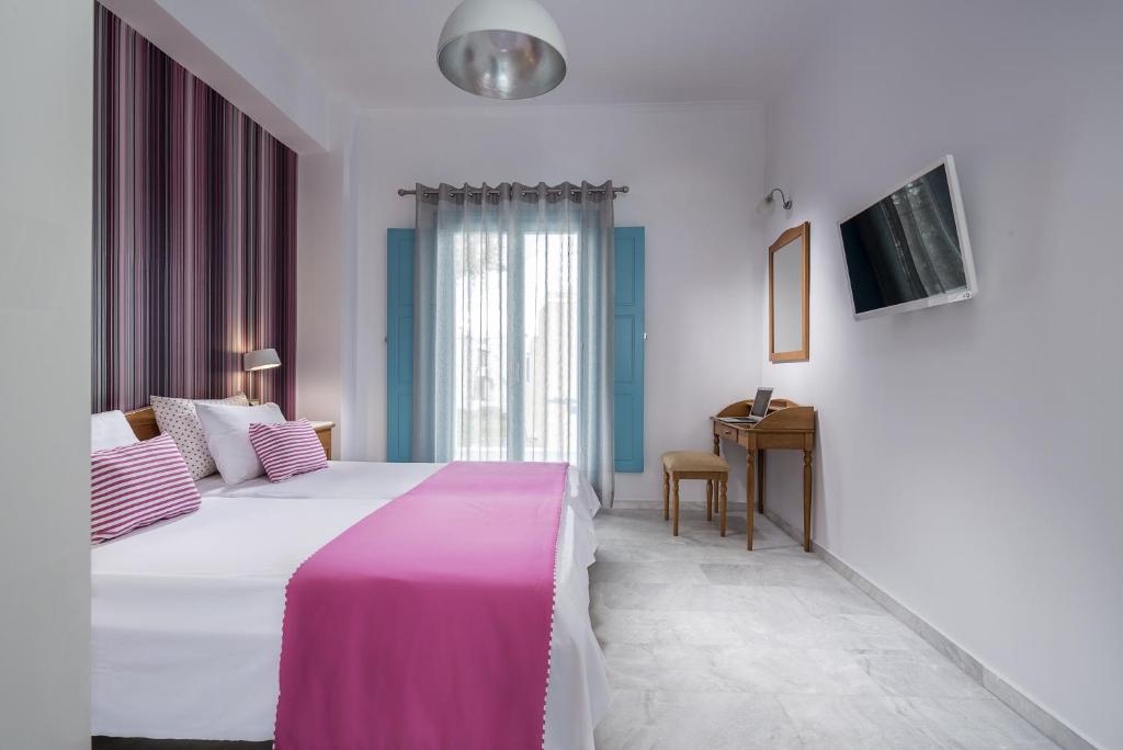 Postel nebo postele na pokoji v ubytování Santellini Hotel
