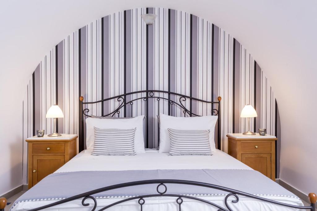 Postel nebo postele na pokoji v ubytování Santellini Hotel