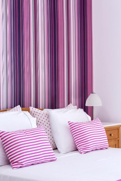 Postel nebo postele na pokoji v ubytování Santellini Hotel