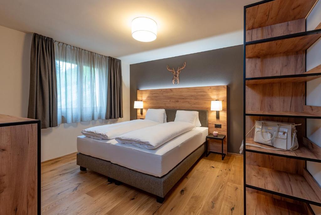 Postel nebo postele na pokoji v ubytování Pradas Resort Brigels