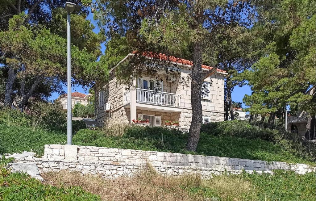a stone house on top of a hill at Apartment Lumbarda Iv in Lumbarda