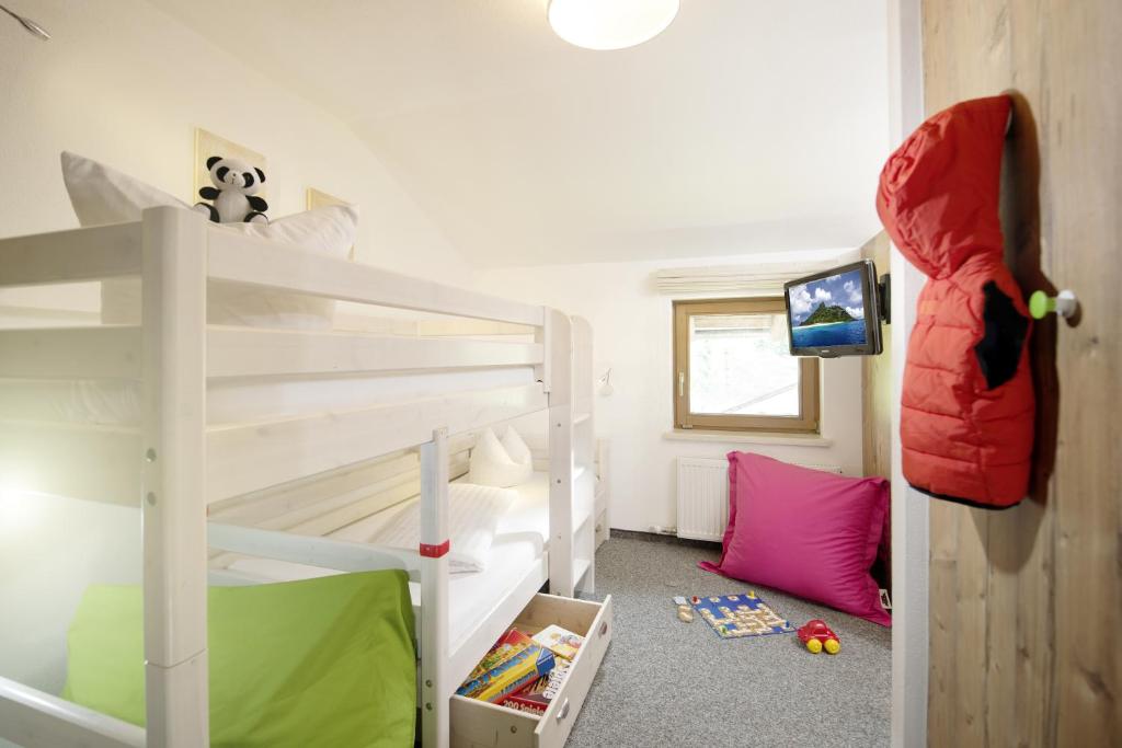 Postel nebo postele na pokoji v ubytování Hotel Maximilian