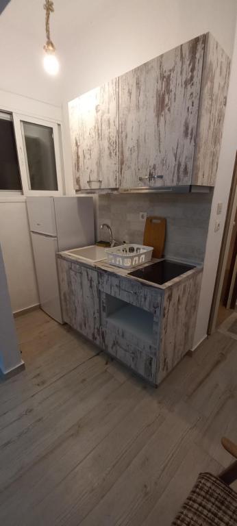 Kuchyň nebo kuchyňský kout v ubytování Velikis Apartments