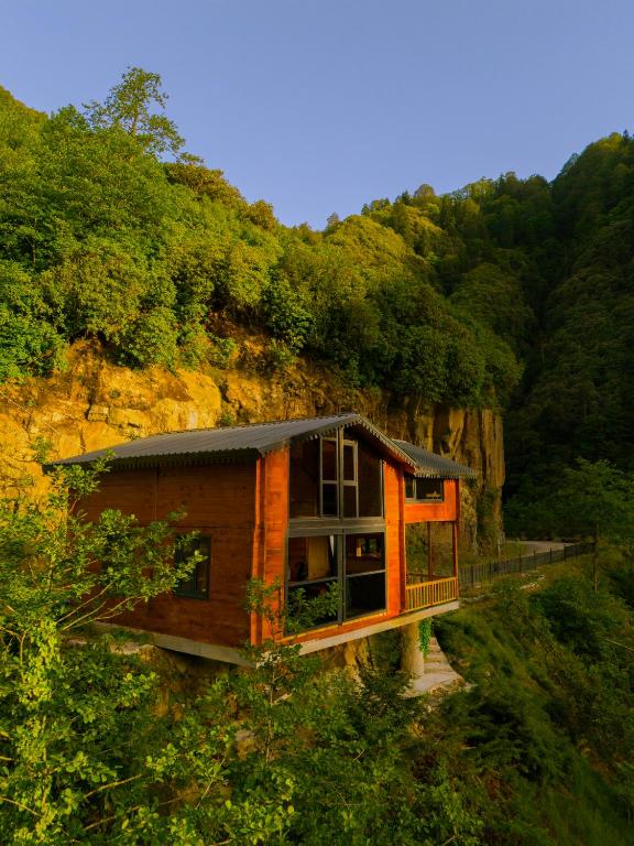 a house on the side of a mountain at Depani Doğa Evleri in Kise