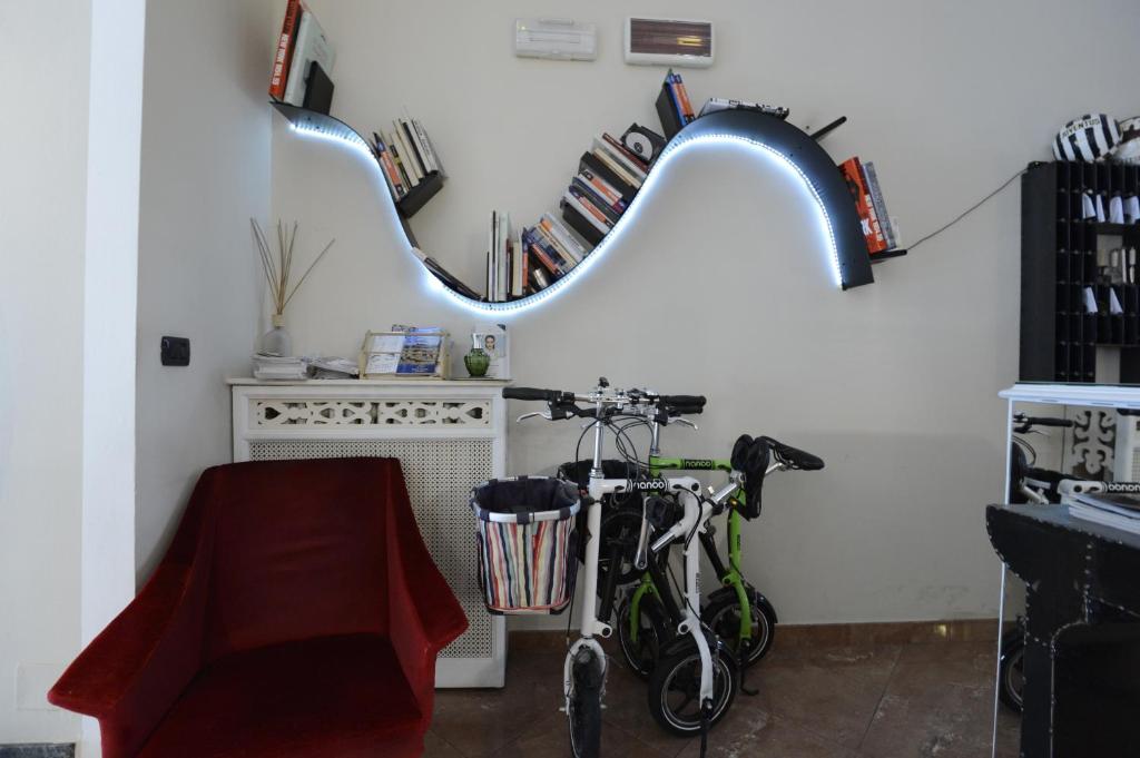 a bike parked in a room with a mirror at Hotel Tourist in Turin
