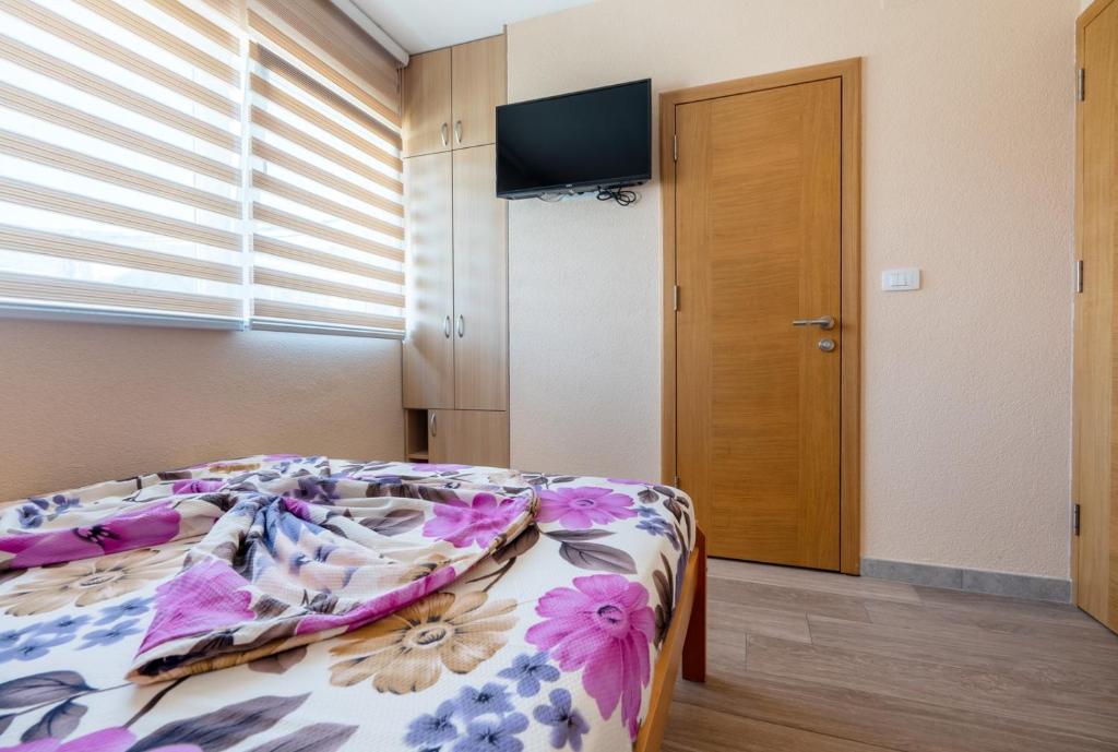 Postel nebo postele na pokoji v ubytování Guest House Ardiana