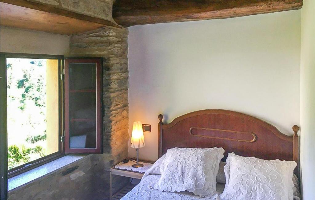 A bed or beds in a room at 3 Bedroom Cozy Home In Ortigueira