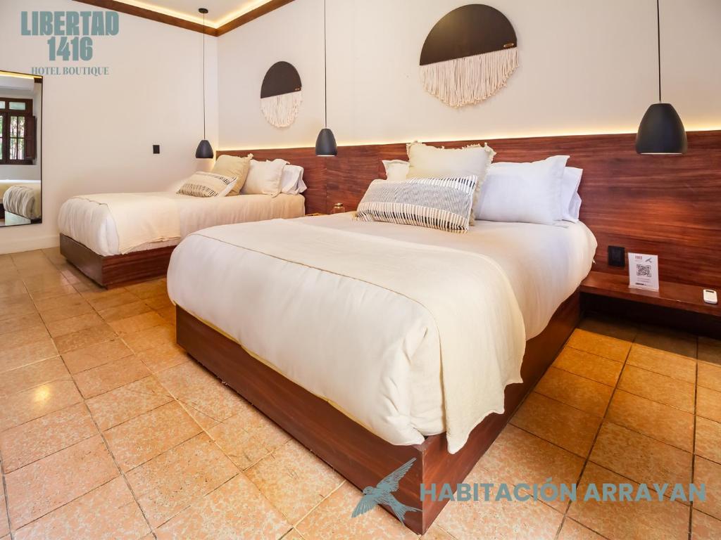 Postel nebo postele na pokoji v ubytování Hotel Libertad 1416