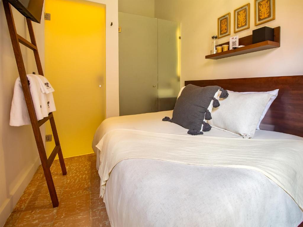 Postel nebo postele na pokoji v ubytování Hotel Libertad 1416