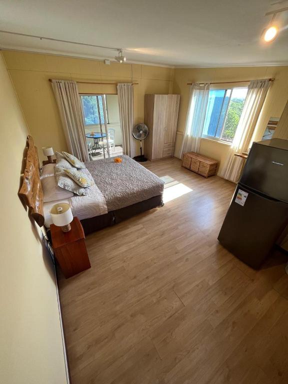 Una cama o camas en una habitación de Hotel Uka Mana