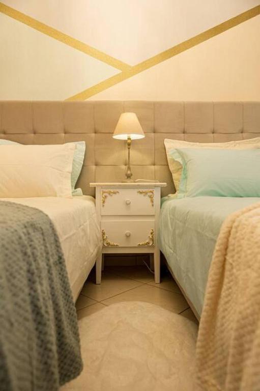 Posteľ alebo postele v izbe v ubytovaní Armonia Rentals Volos Flat
