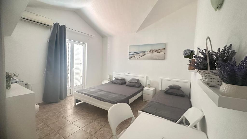Letto o letti in una camera di Zvezda Meljine