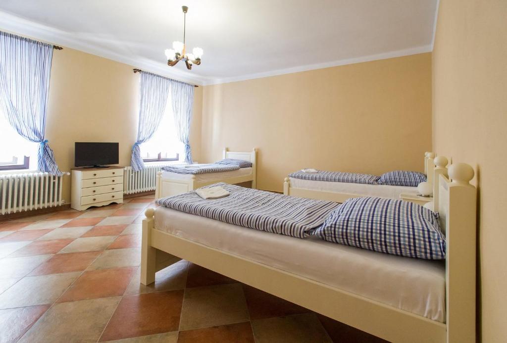 Postel nebo postele na pokoji v ubytování Penzion u Františka