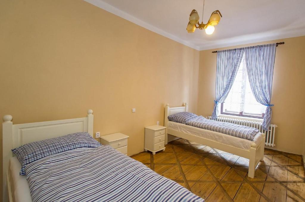 Postel nebo postele na pokoji v ubytování Penzion u Františka