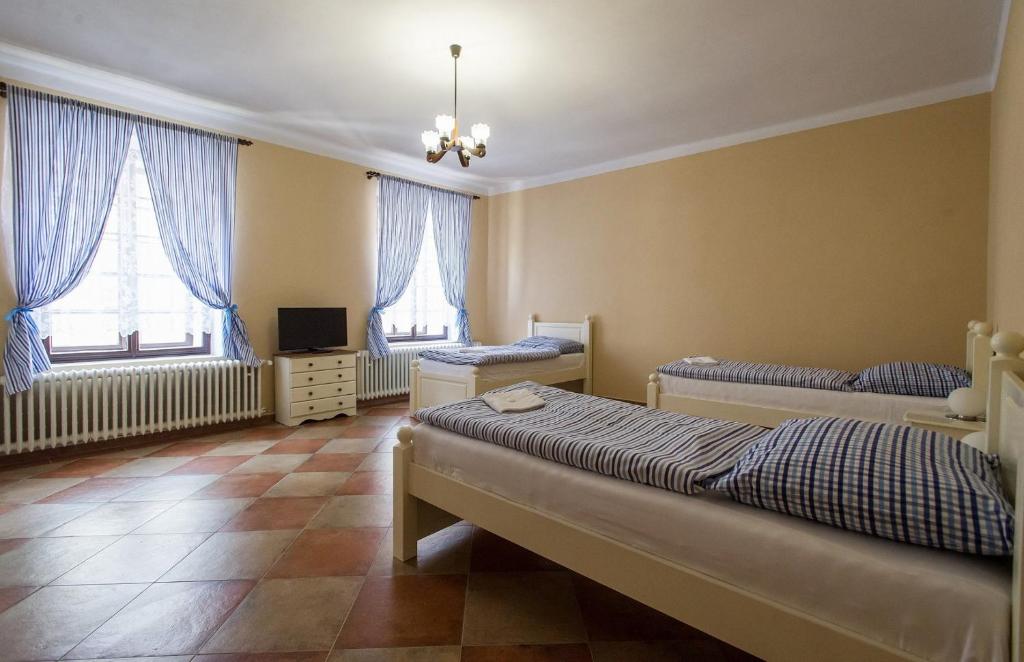 Postel nebo postele na pokoji v ubytování Penzion u Františka