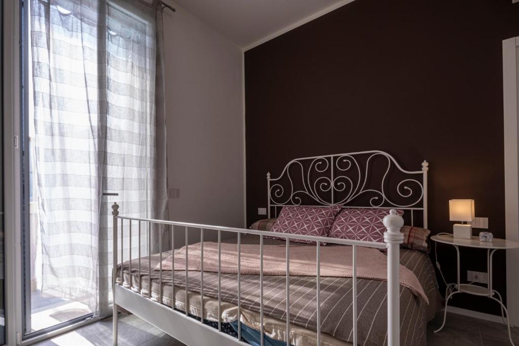 Postel nebo postele na pokoji v ubytování CA' DEL RE SCARTOZZ