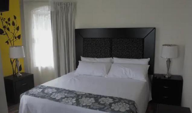 Ένα ή περισσότερα κρεβάτια σε δωμάτιο στο Villas Tecuanapan