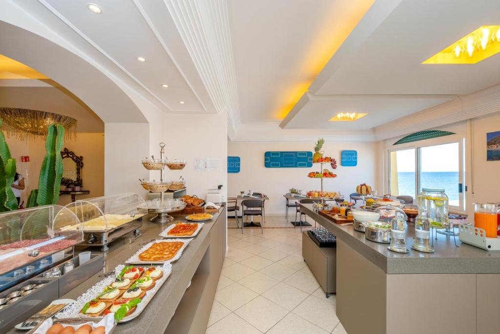 a buffet in a hotel with a lot of food at Hotel Albatros Varigotti in Varigotti