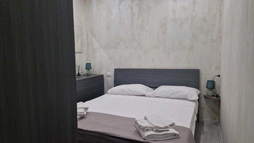 Letto o letti in una camera di Adriano's Rooms