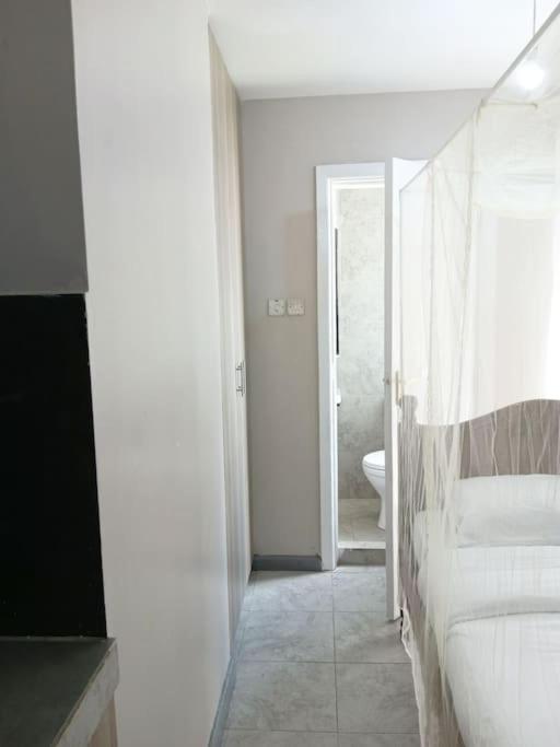 Postel nebo postele na pokoji v ubytování Maya Nest Lounge