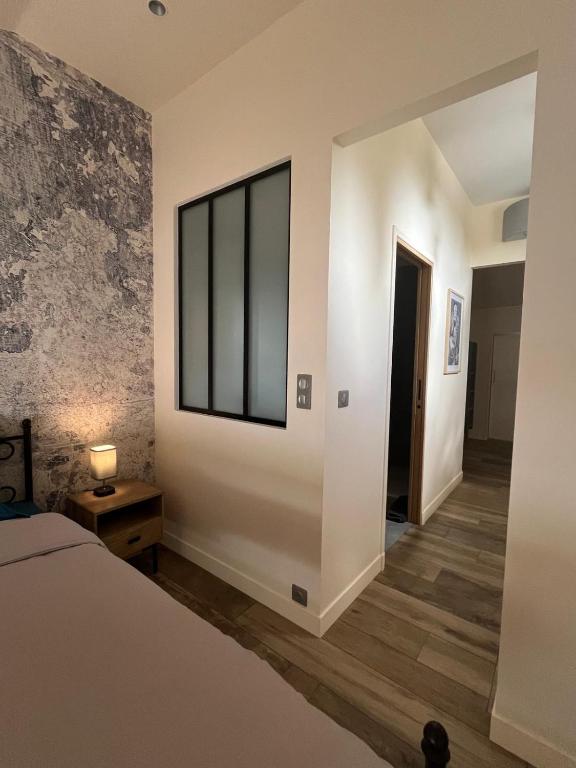 Postel nebo postele na pokoji v ubytování L'Oustalet des Alpilles