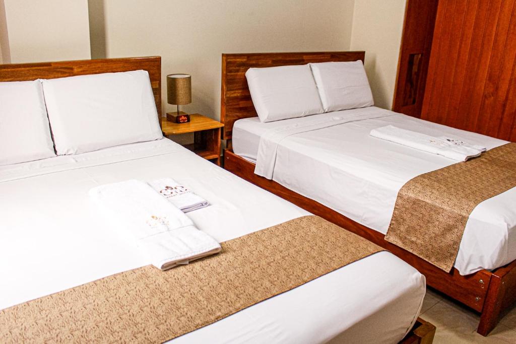 Postel nebo postele na pokoji v ubytování Studio 69 Aparthotel