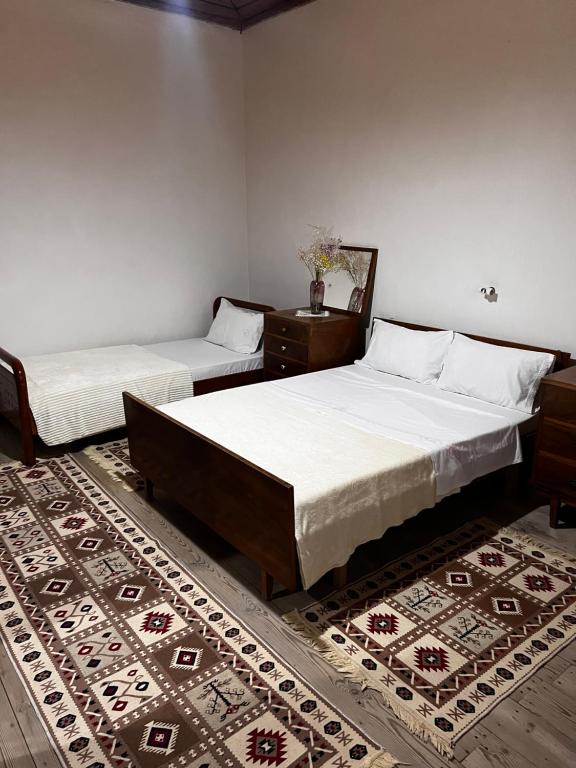 Postel nebo postele na pokoji v ubytování Tourists Guest House