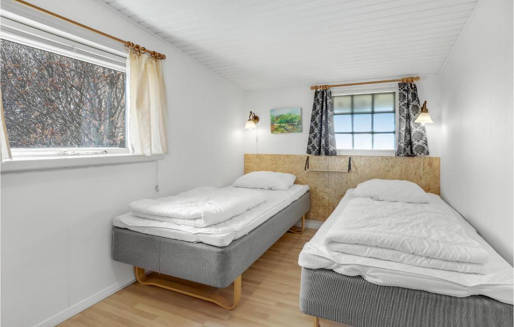 Postel nebo postele na pokoji v ubytování Two-Bedroom Holiday Home In Ostermarie