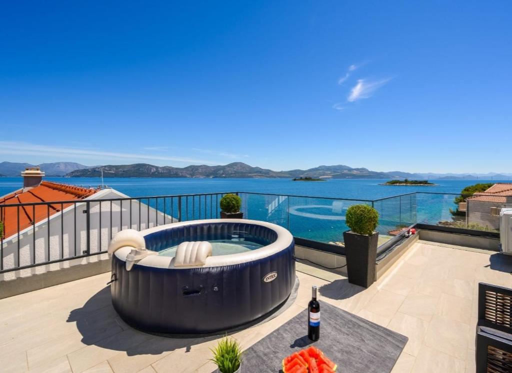 a hot tub on the roof of a house at Villa Zvonimir in Sreser