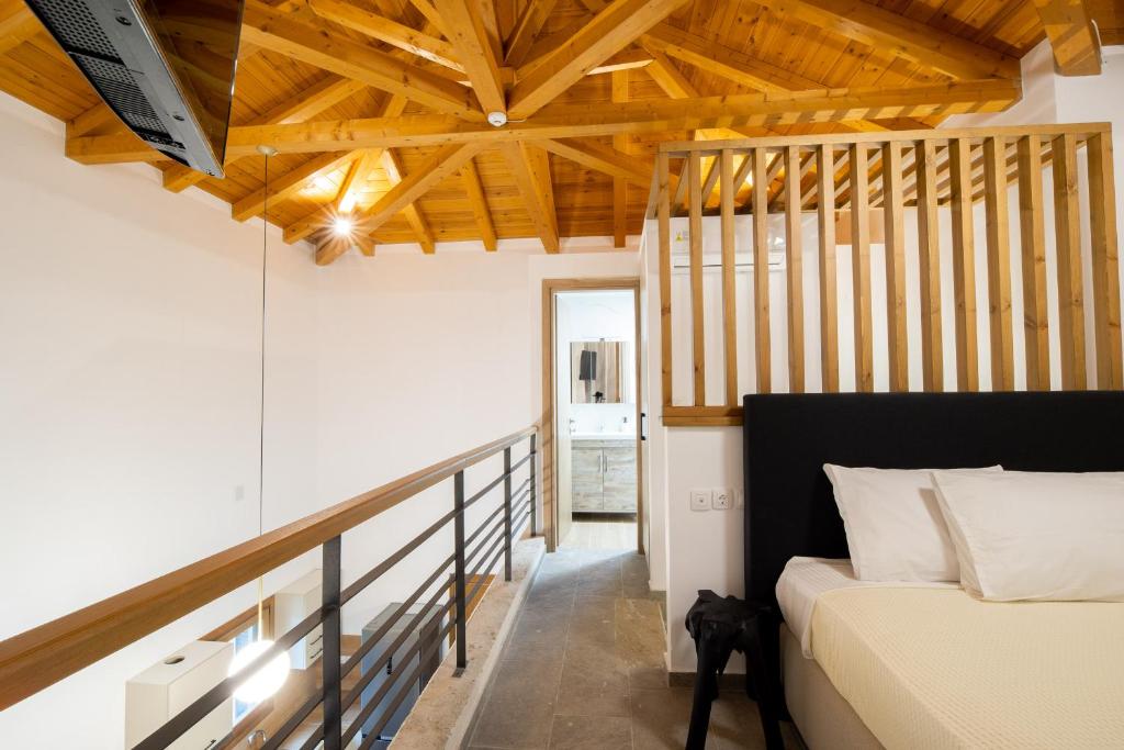 Postel nebo postele na pokoji v ubytování ΕΠΟΣ hotel